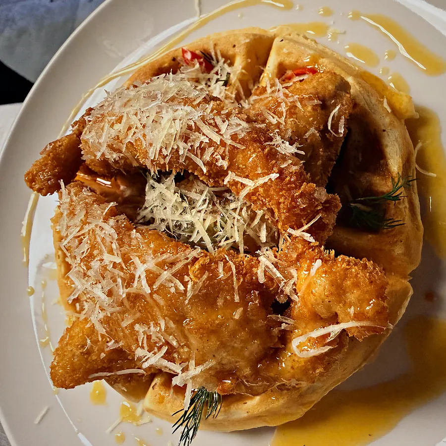 Dirty Anna Waffle — crumbed chicken on a crispy waffle with cheese, honey and chilli